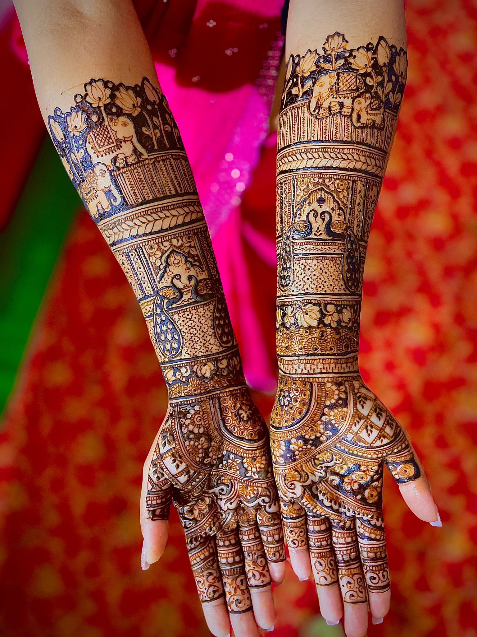 Intricate traditional bridal mehndi design on full hands in Guwahati
